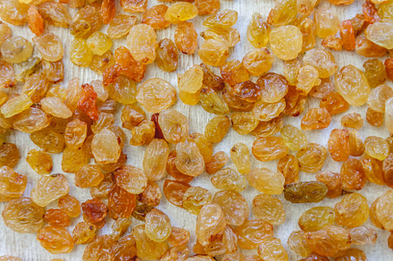 Background from light yellow raisins. Close-up., a Food & Drink Photo by TanaCh