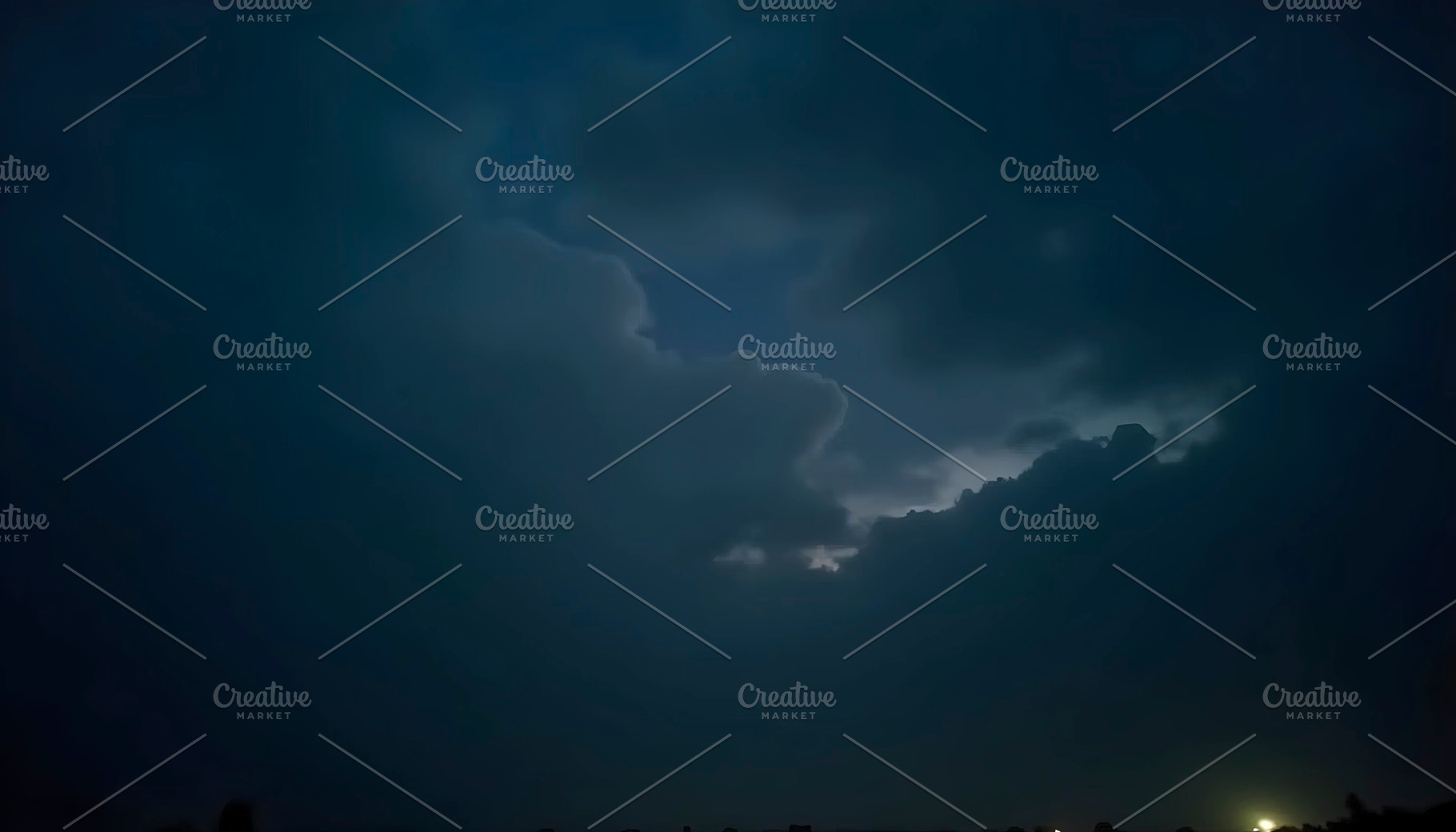 Faint Urban Glow Below Rolling Night, a Photo by LOGOCREATIVE