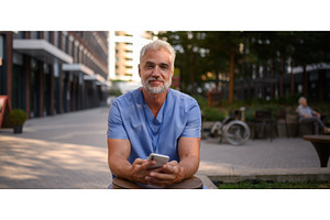 Healthcare worker outside hospital, a Health & Medical Photo by HalfPoint