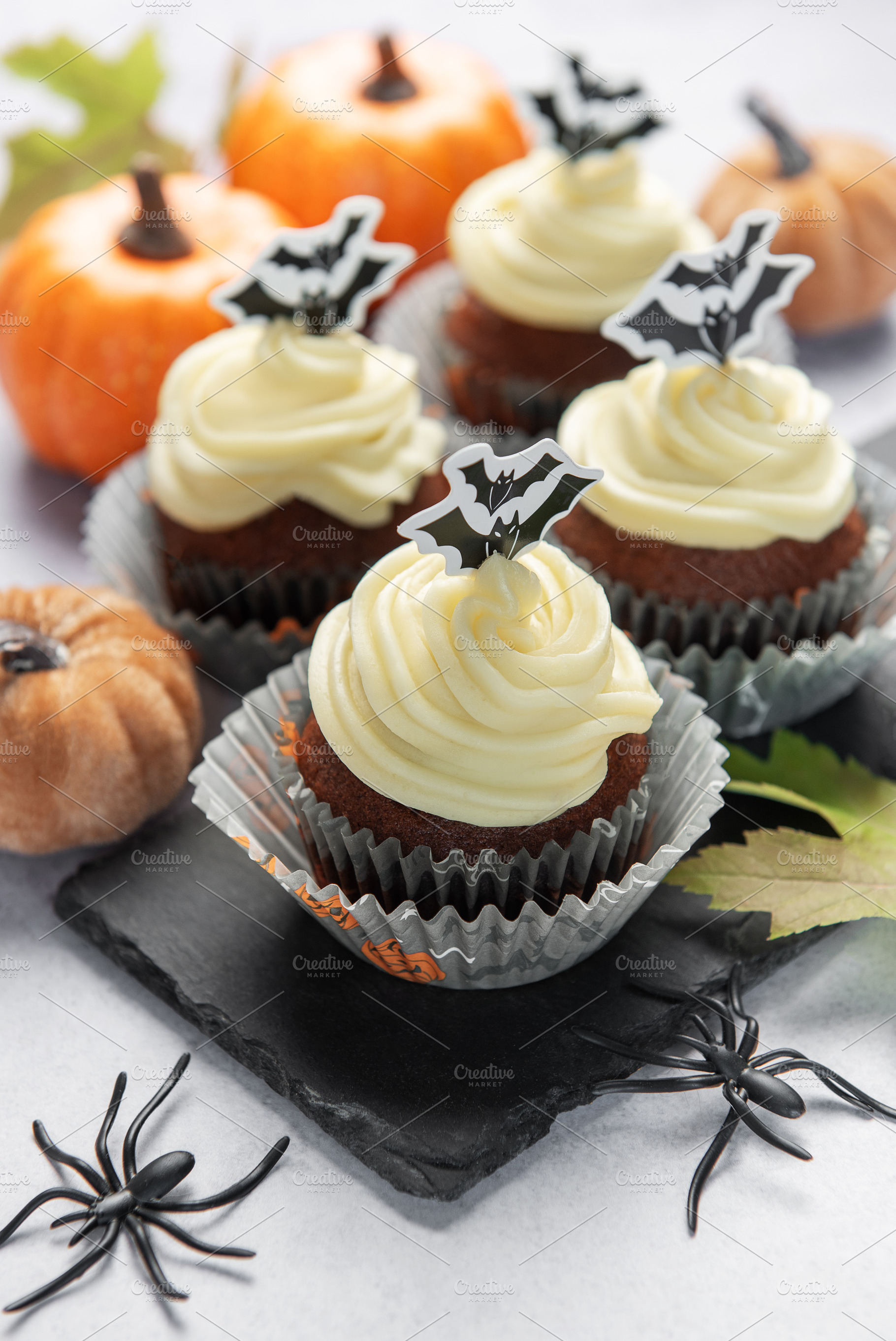 Halloween cupcakes with bat toppers and pumpkin decorations, a Food & Drink Photo by Olena Rudo