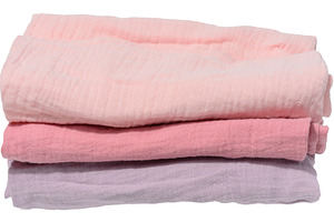 Stack of three folded cotton towels in pastel shades on isolated, a Technology Photo by ndanko