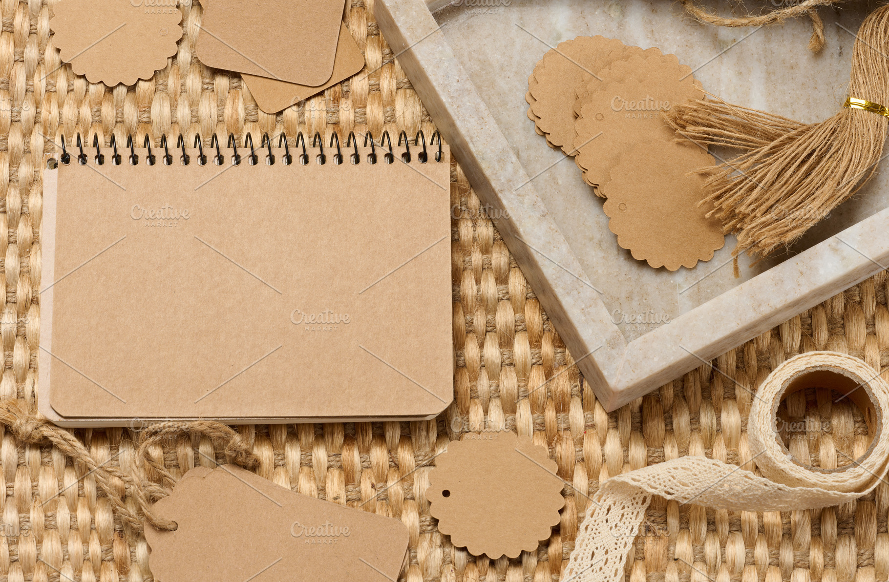 Blank notepad and various craft supplies made of recycled paper, a Background Photo by ndanko
