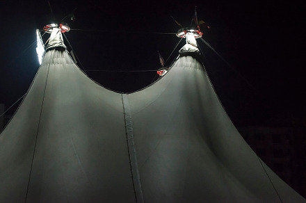 Illuminated circus dome containing circus, tent, and dome