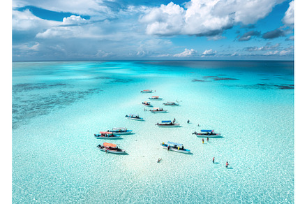 Aerial view of boats in clear azure, a Nature Photo by den-belitsky