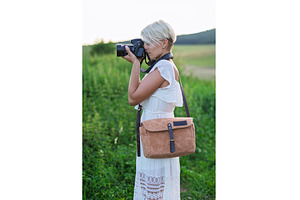 Side view of female photographer, a Person Photo by HalfPoint