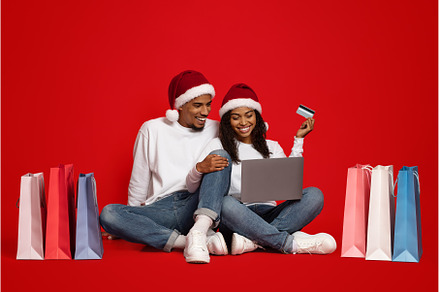 Excited black couple with shopping, a Person Photo by Prostock-Studio