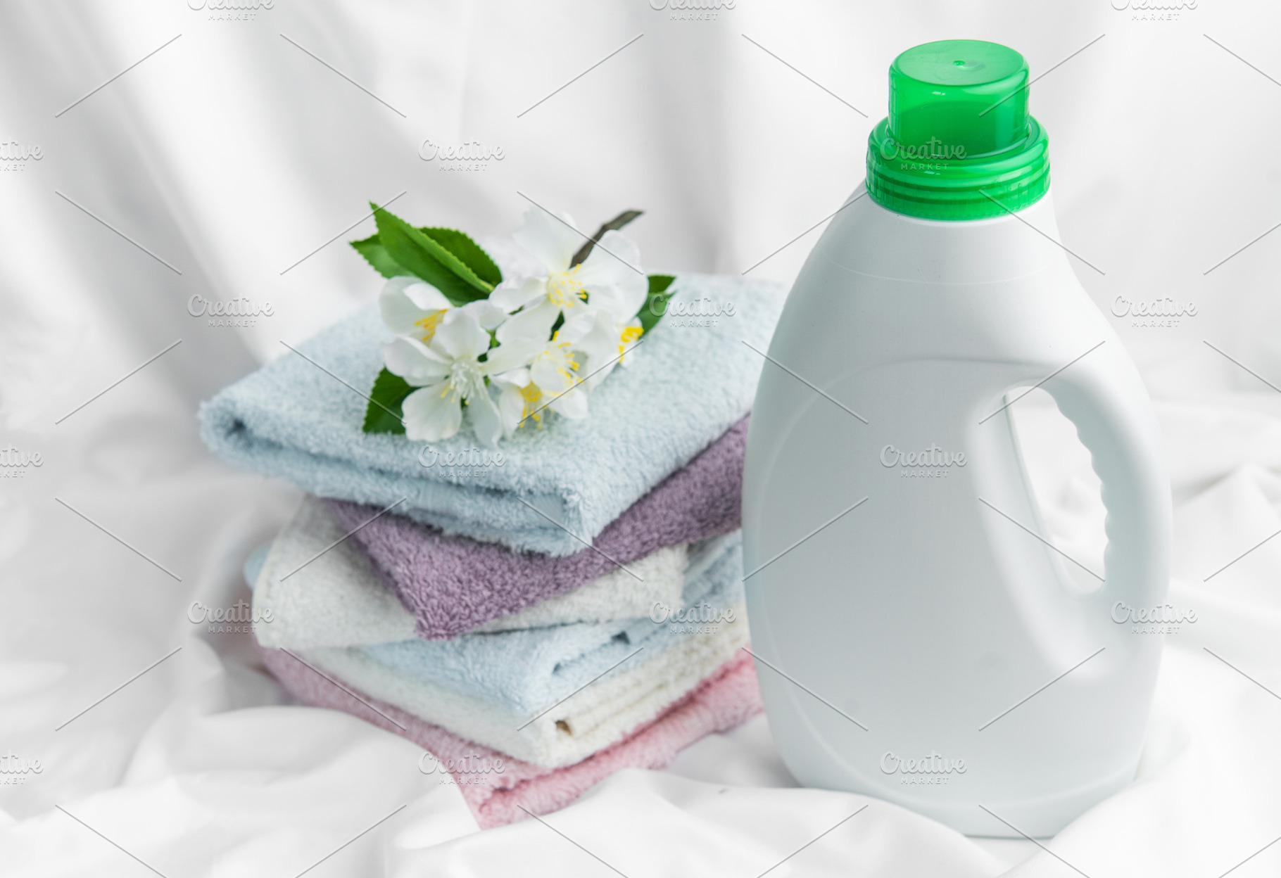Fresh laundry concept with detergent and soft towels, an Industrial Photo by Olena Rudo