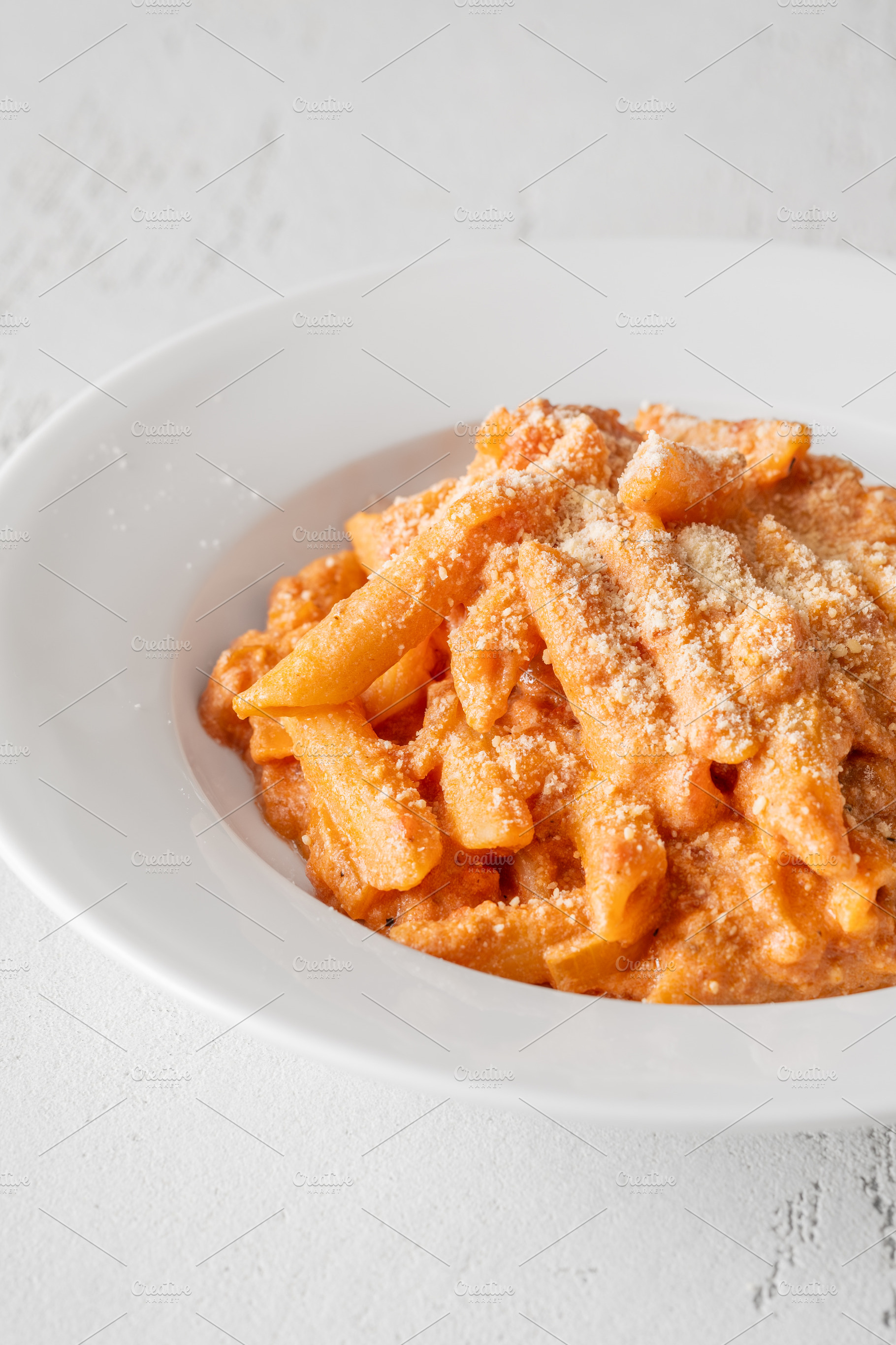 Penne pasta in creamy ricotta tomato, a Food & Drink Photo by Alexander Prokopenko