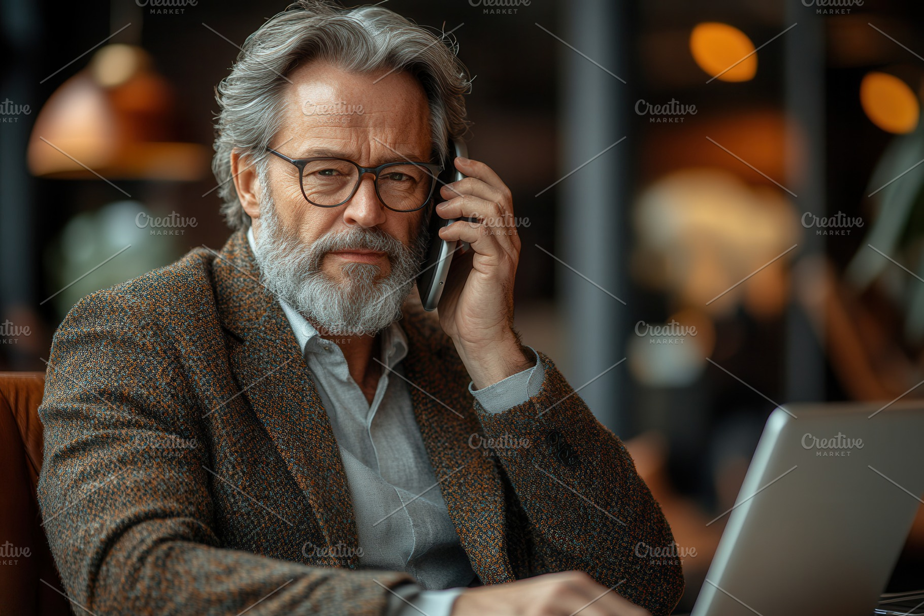 Older man engaged in business call w, a Photo by Tanuart