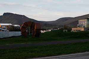 Outdoor scenery of Akranes, Iceland with modern architecture and mountain backd, a Photo by AS photostudio