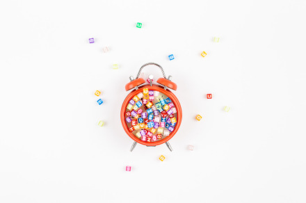 Alarm clock and multicolor alphabet, a School & Education Photo by Dvoevnore photos