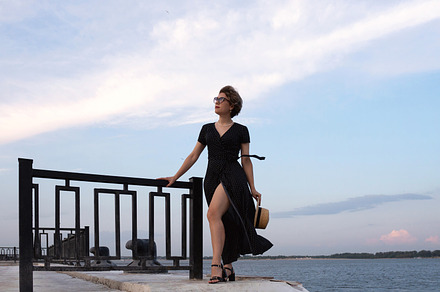 Confident woman in black dress