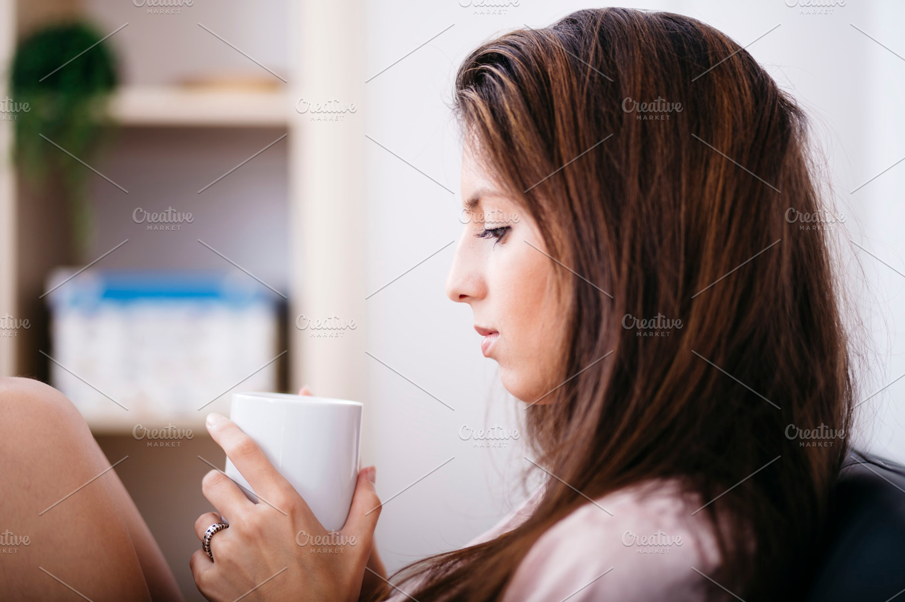 Woman drinking tea at home, a Person Photo by fotopitu
