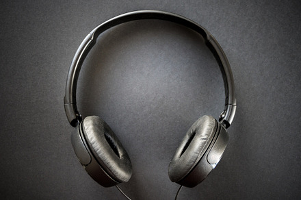 Headphones on a black background, a Technology Photo by GoodGoods