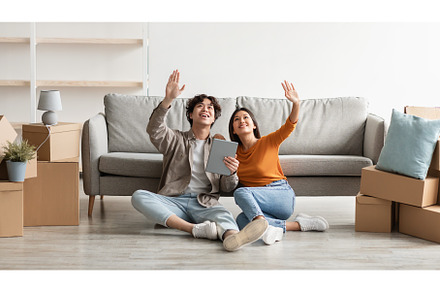 Millennial Asian couple sitting on, a Person Photo by Prostock-Studio