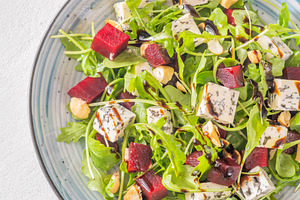 Beetroot arugula salad with blue cheese nuts and balsamic glaze, a Food & Drink Photo by Alexander Prokopenko