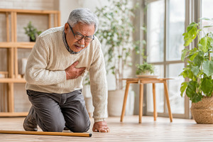 Elderly man experiencing chest pain, a Photo by Pixeness Studio