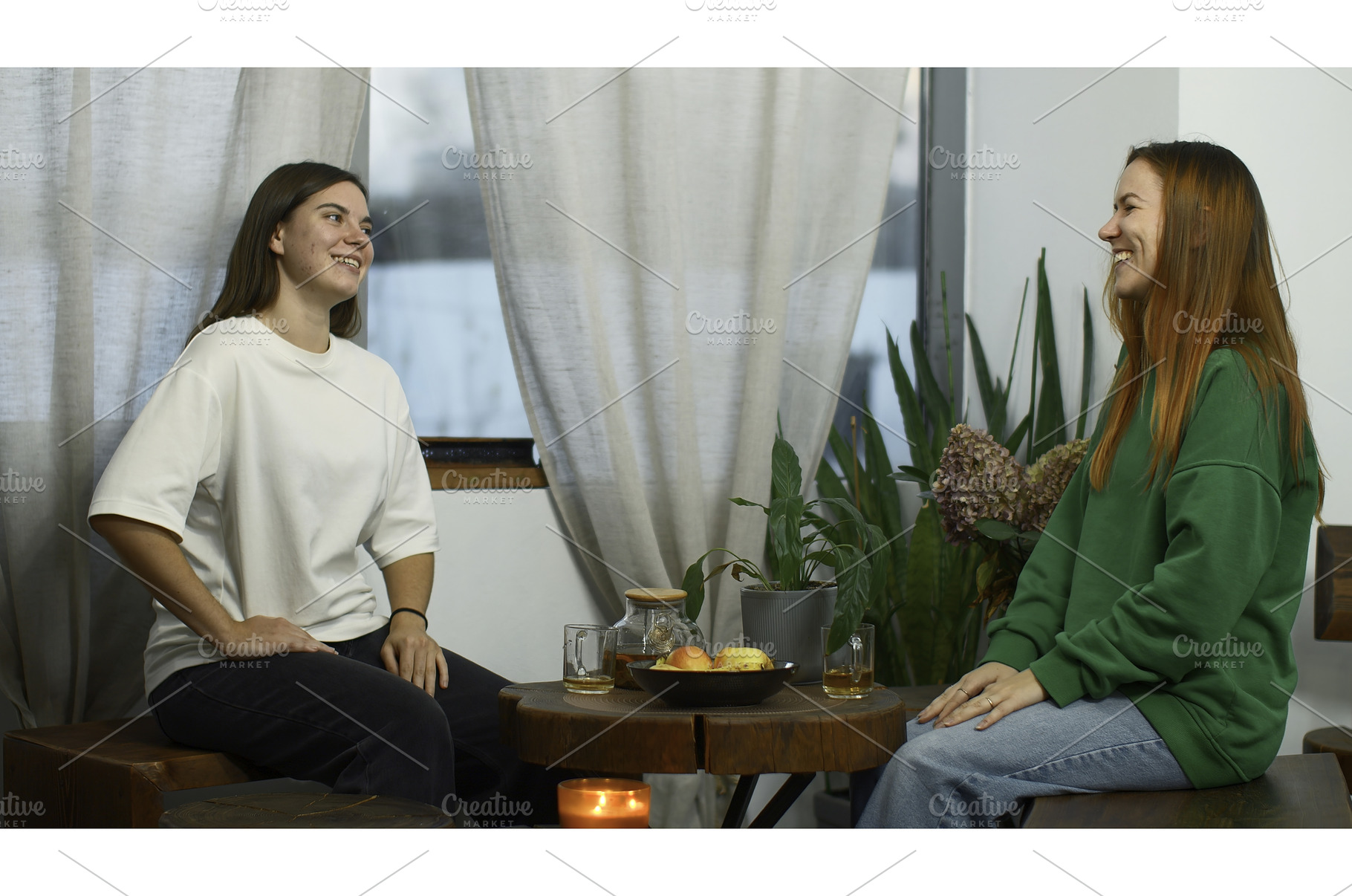 Young women drink tea and have fun, a Person Photo by Media Whale Stock