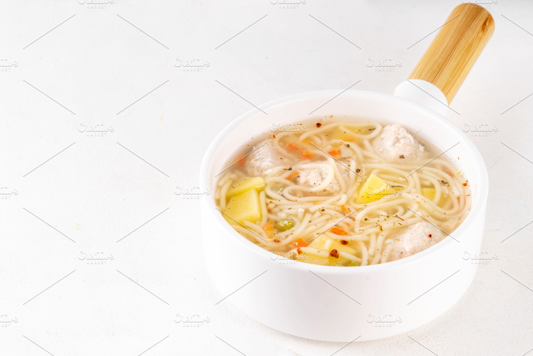 Homemade soup with chicken or turkey meatballs, a Food & Drink Photo by Rimma