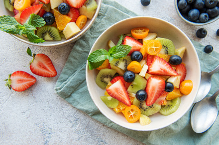 Healthy fresh fruit salad in a bowl, a Food & Drink Photo by Olena Rudo