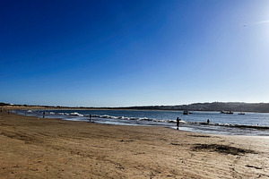 Bright beach day in Cascais Portugal under clear sunny skies, a Photo by AS photostudio