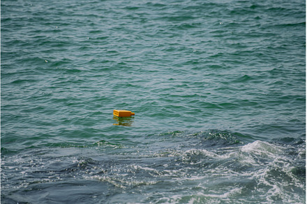Close up of floating trash in sea., an Industrial Photo by HalfPoint