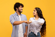 Partnership and collaboration work as team. Young indian woman and man making f, a Photo by Prostock-Studio (Thumbnail 2 of 3)