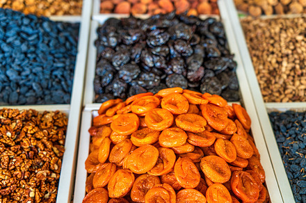 Oriental dried fruits and nuts on the counter of the bazaar., a Food & Drink Photo by Eugene_Photo