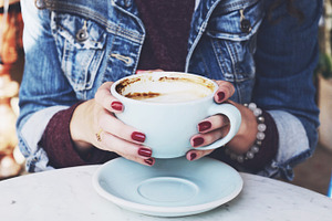 Morning coffee containing coffee, hands, and cup