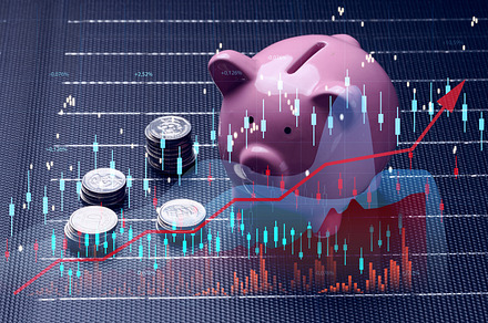 A stack of coins and a ceramic piggy bank stands on a solar pane, a Business Photo by ndanko