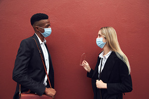 Businessman And Businesswoman Wearin