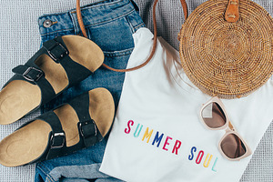 Flat lay with summer women's clothing and accessories. White t-shirt, denim sho