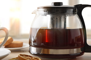 Detail of teapot full of black tea, a Food & Drink Photo by Davizro's Market