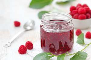 Raspberry jam in a jur and fresh