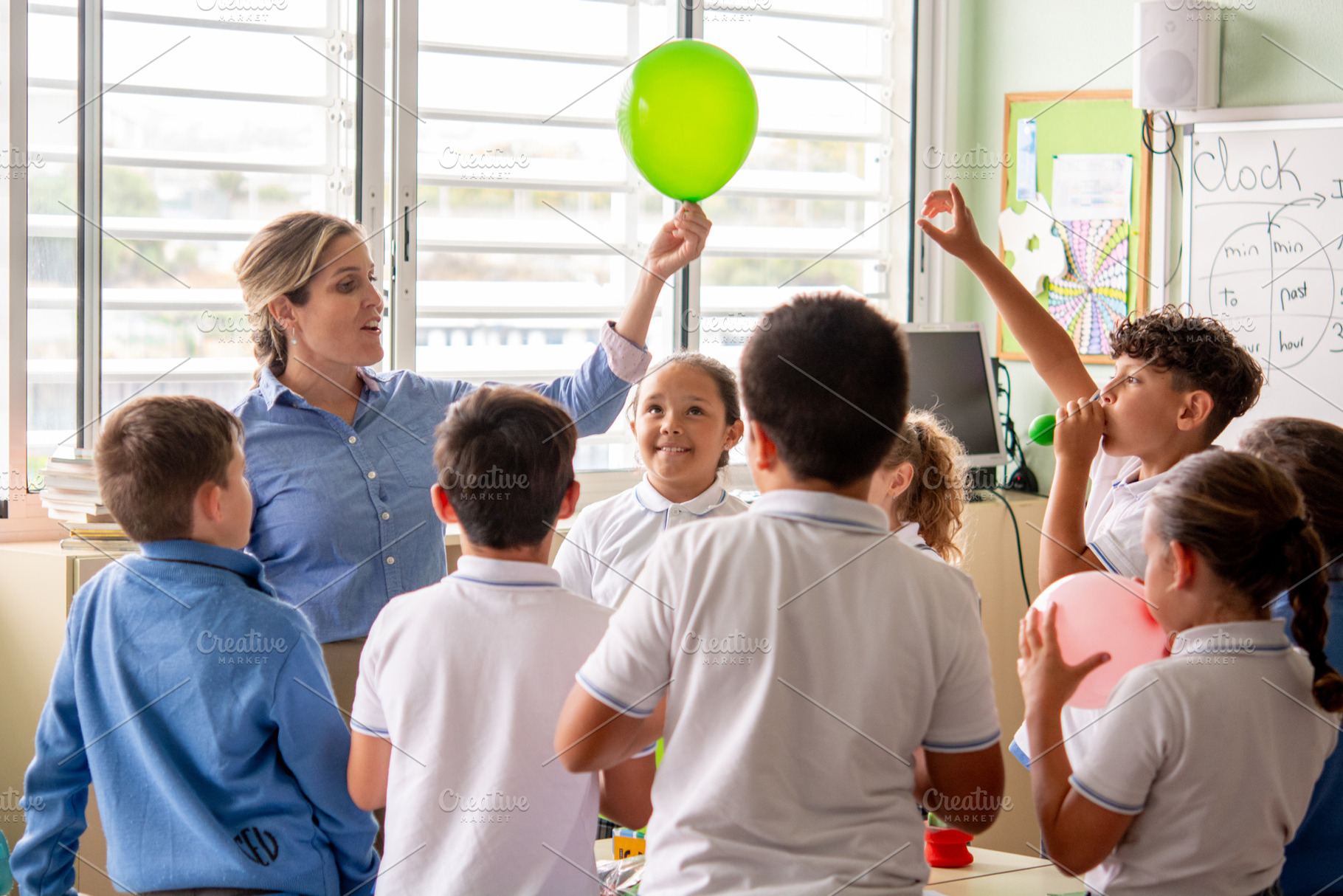 Elementary School Teacher Conducting Interactive Science Activity with Students, a School & Education Photo by etorres69