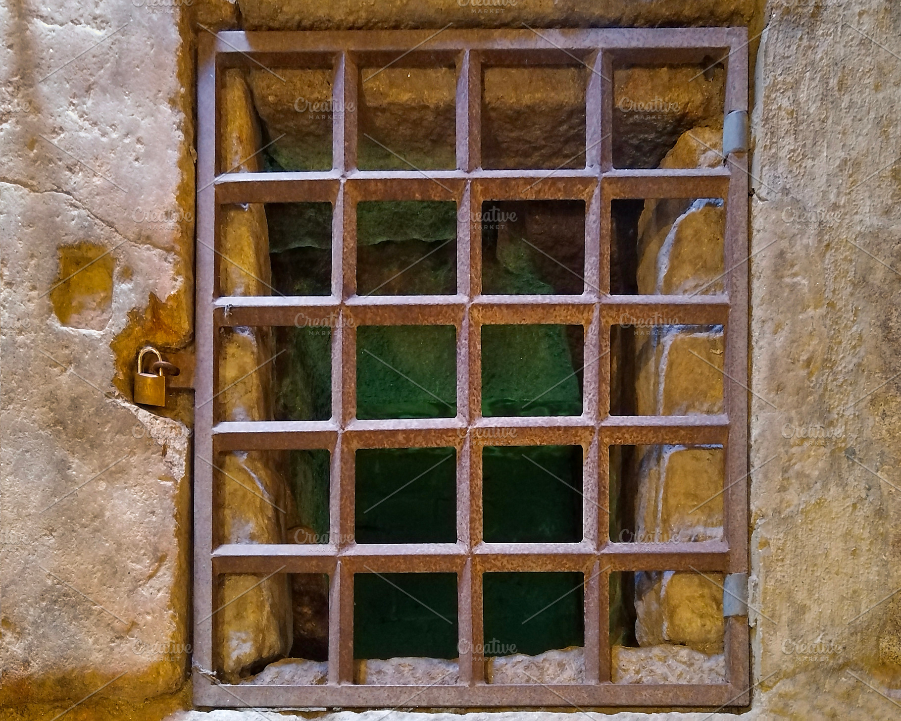 Iron cell bars on stone wall in historical site, an Architecture Photo by DanFLCreativo