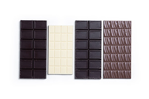 Assortment of white, milk and dark chocolate pieces, a Photo by etorres69