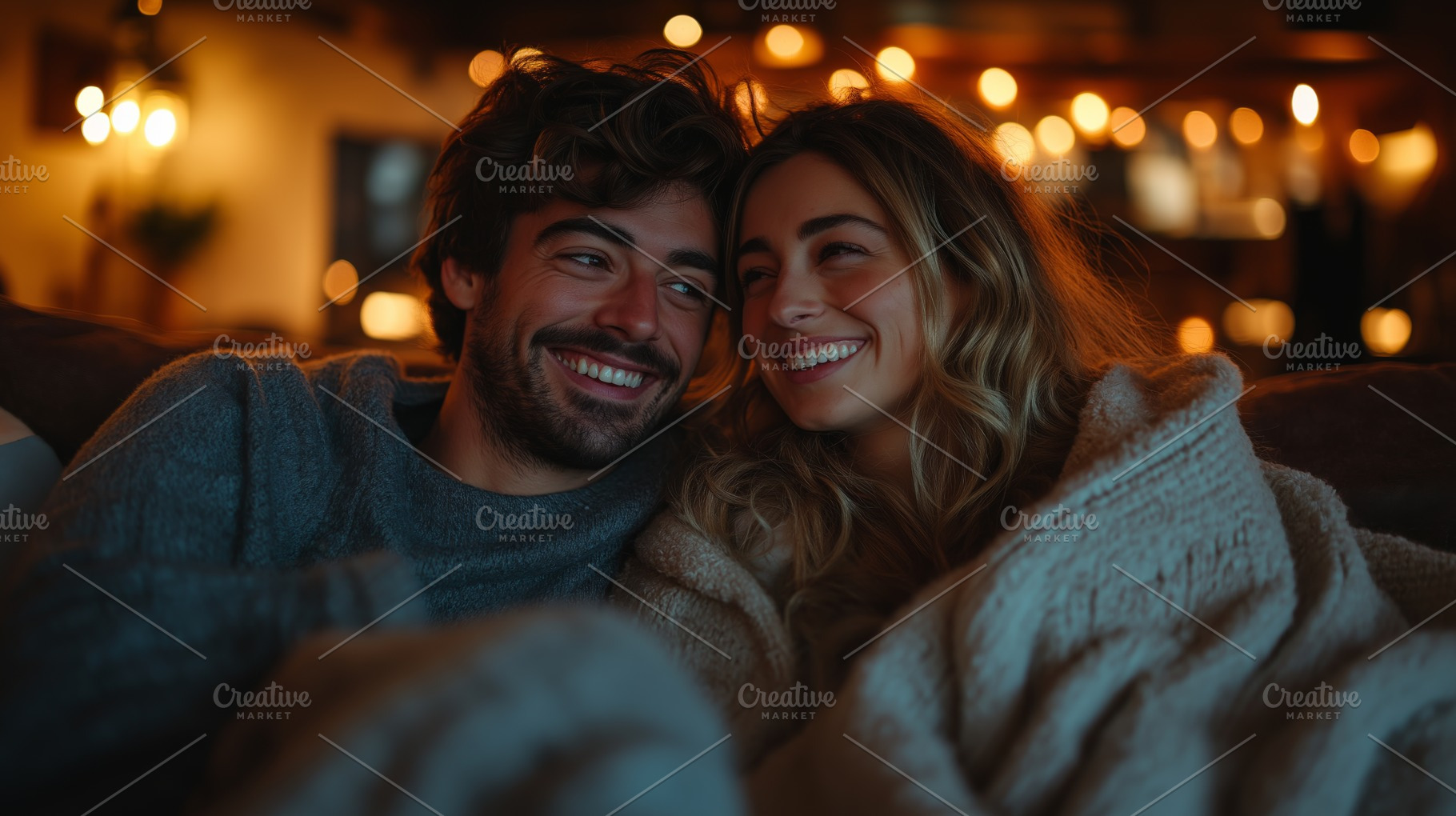 A smiling couple cuddles under a warm blanket, enjoying a cozy evening together, a Person Photo by ImageMir