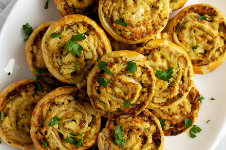 Homemade Chicken Pesto Pinwheels on a Plate, top view. Flat lay,, a Food & Drink Photo by LiudmylaChuhunova