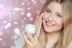 Woman applying face cream to glowing skin, promoting beauty, wel, a Person Photo by Studio ANNA