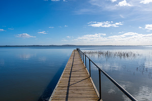 Wooden pier extending over Lake Colac, Victoria, Australia on a, a Nature Photo by GoodGoods