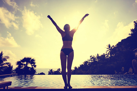Silhouette of a woman stock photo containing pool and infinity, a Holiday Photo by Olezzo