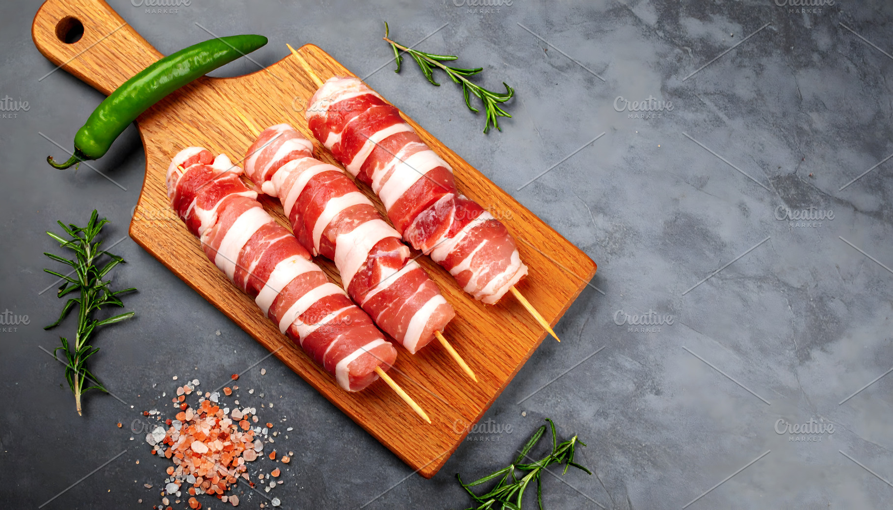 Bacon Wrapped Skewers on a Wooden Bo, a Food & Drink Photo by Stock Shape