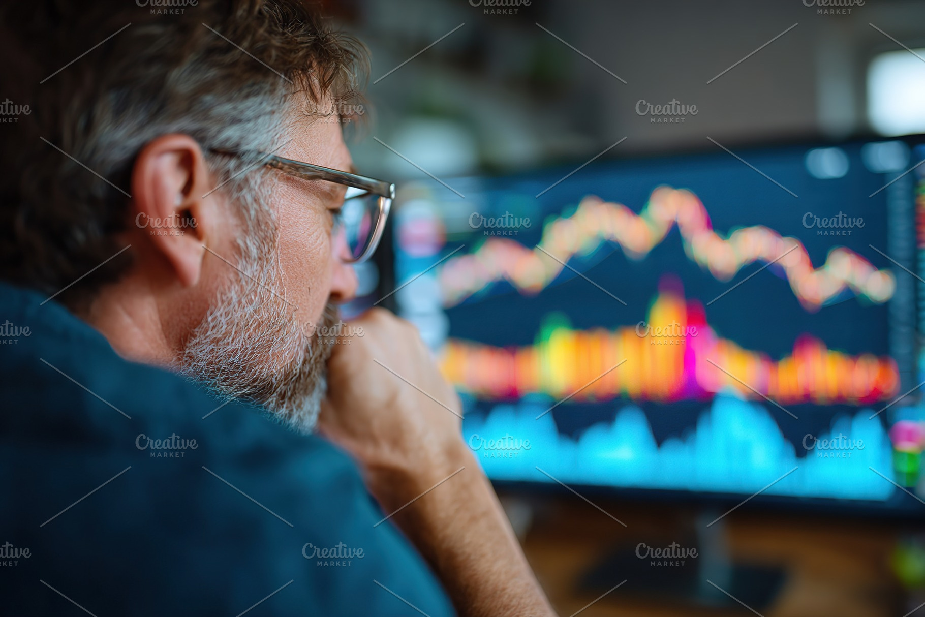 Individual analyzing financial data on a computer screen with visual graphs and, a Person Photo by AlyaAnd