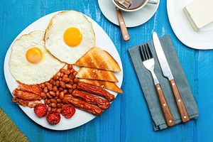 Full english breakfast with fried eggs, sausages, bacon, beans, tomatoes and to, a Food & Drink Photo by Antonio Gravante Market