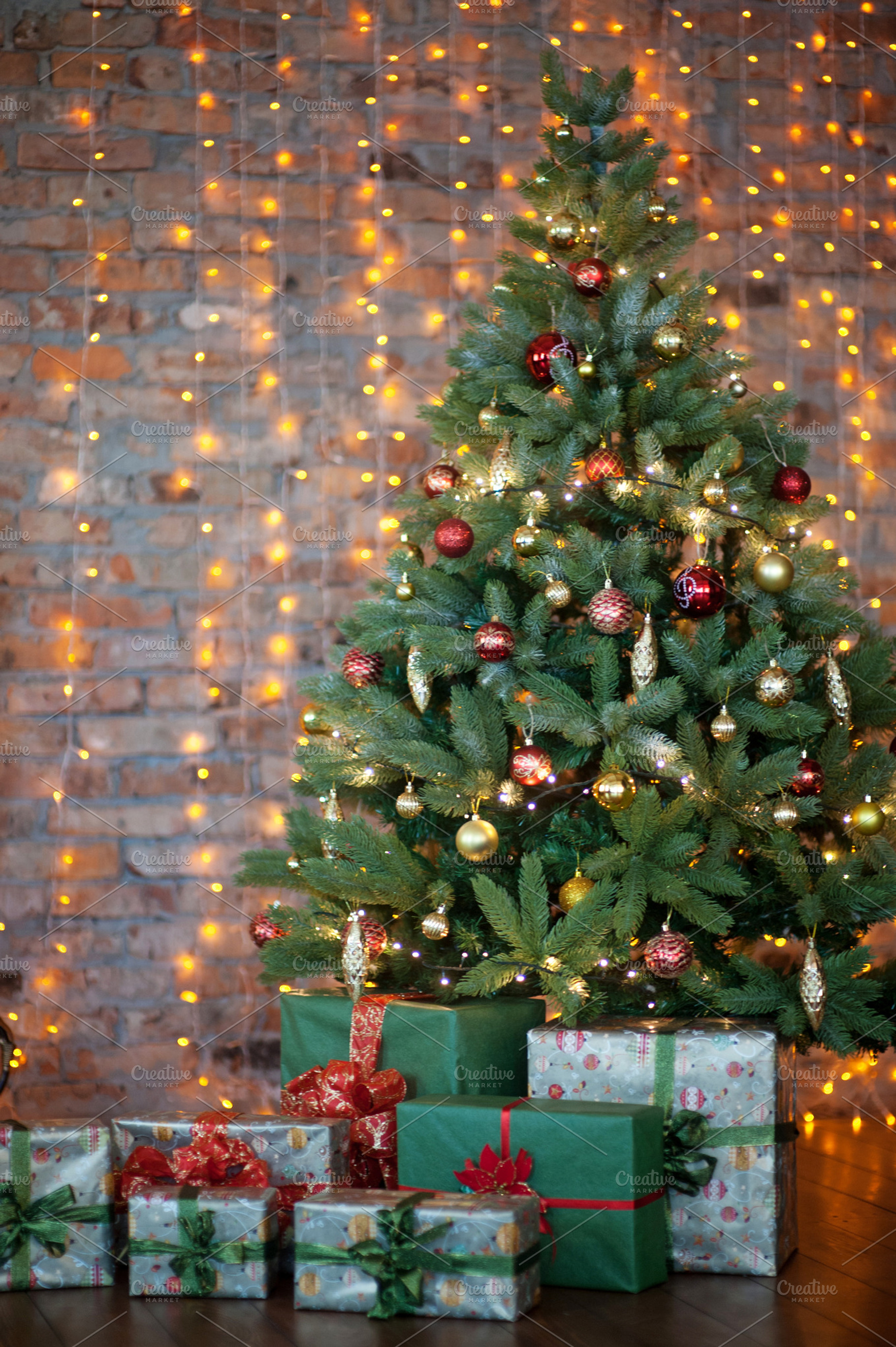 Colorful gifts and presents under a beautiful christmas tree, a Holiday Photo by MarinaMassel