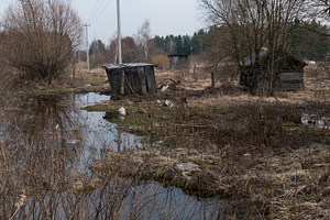 Old poor village and spring flooding stock photo containing landscape and