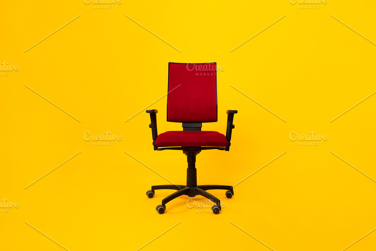 Front View Of Red Adjustable Office Chair Over Yellow Background, a Photo by Prostock-Studio (Photo 1 of 2)