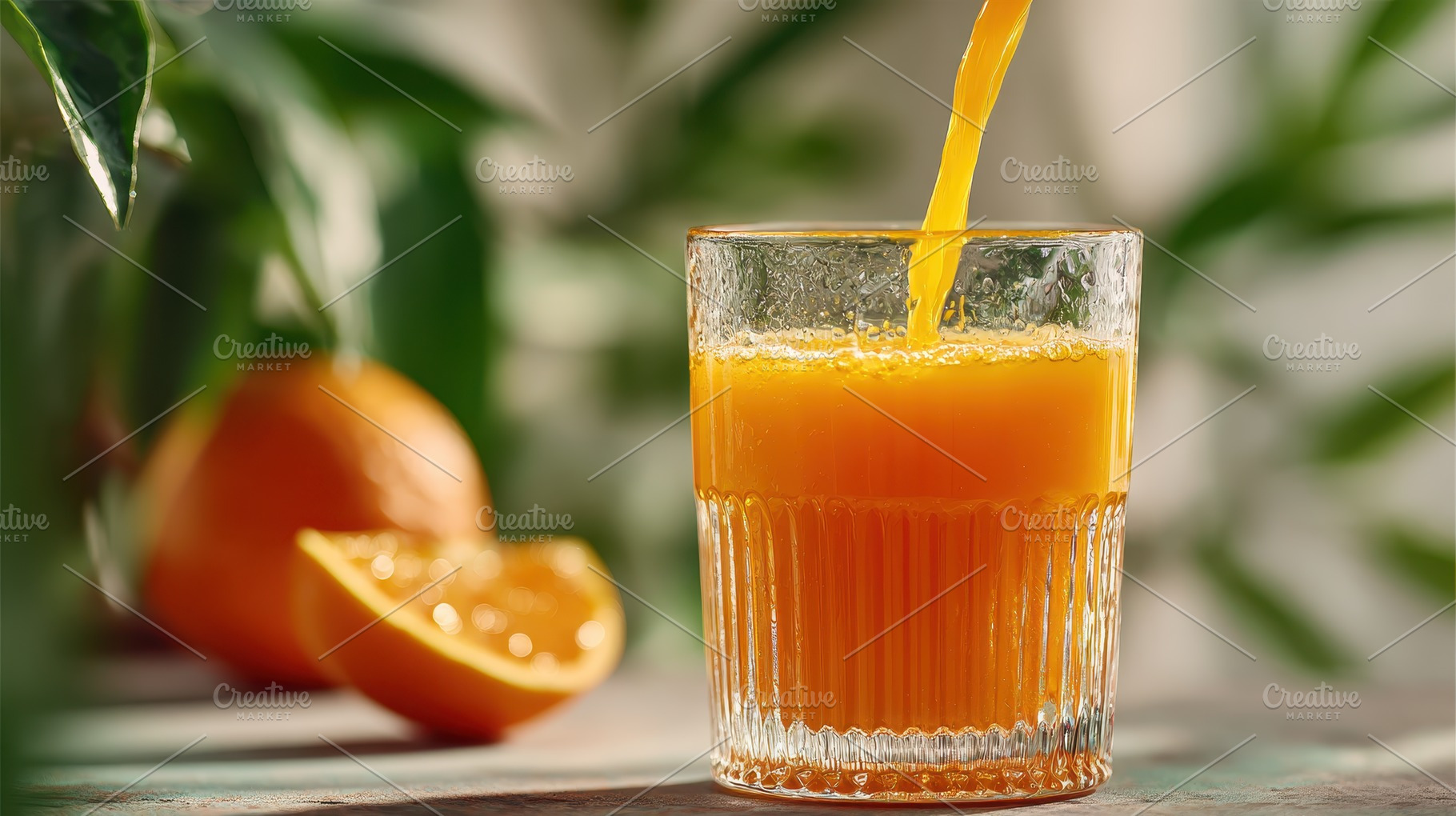 Fresh Orange Juice Pouring into Glas, a Photo by Pixeness Studio