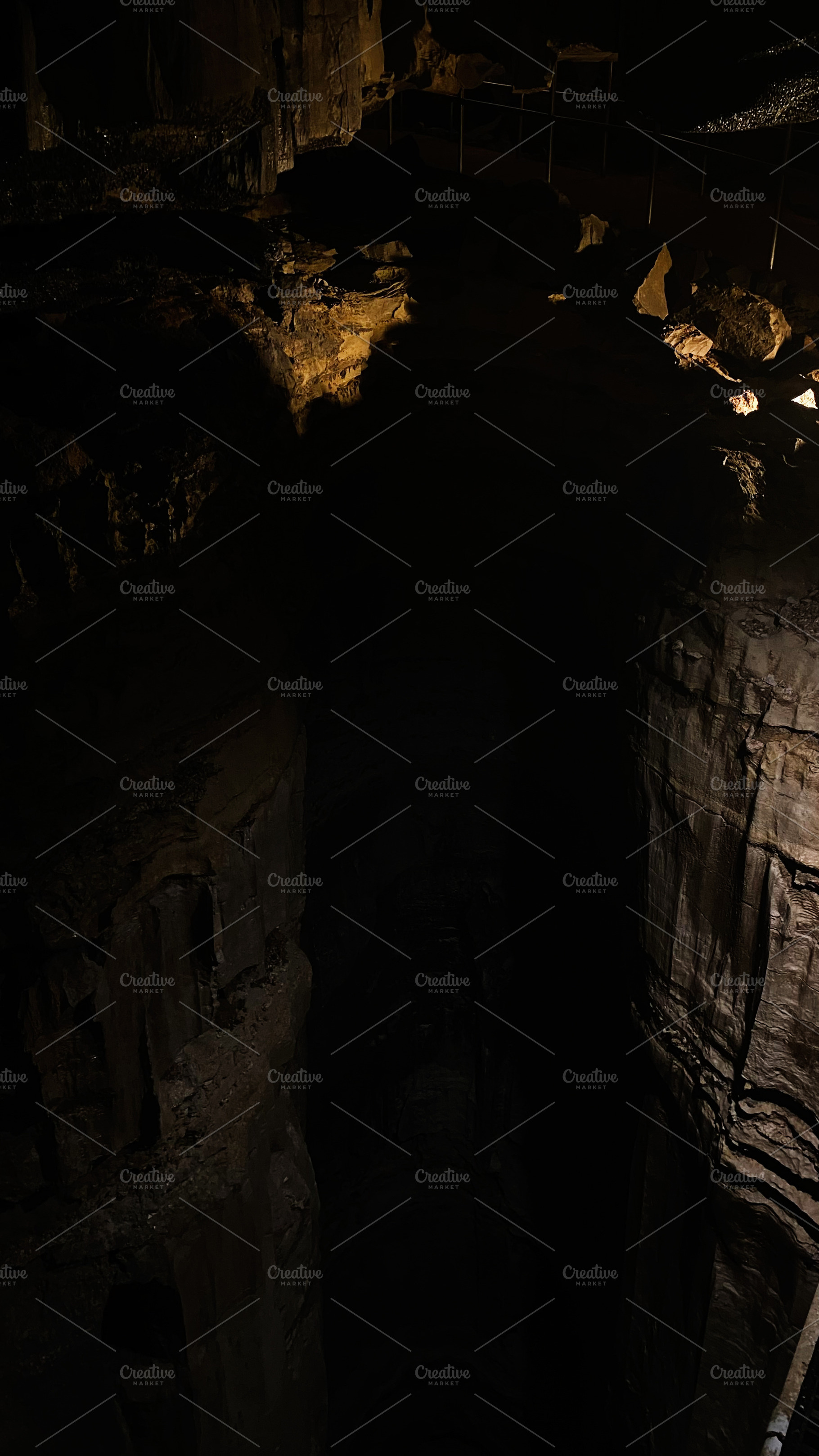 Dark cave interior at Mammoth Cave Kentucky showing rugged rock walls and deep, a Nature Photo by AS photostudio